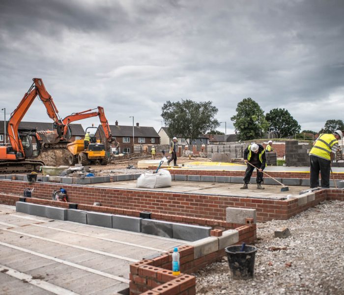 workers-laying-bricks-on-construction-site-2023-11-27-05-33-10-utc